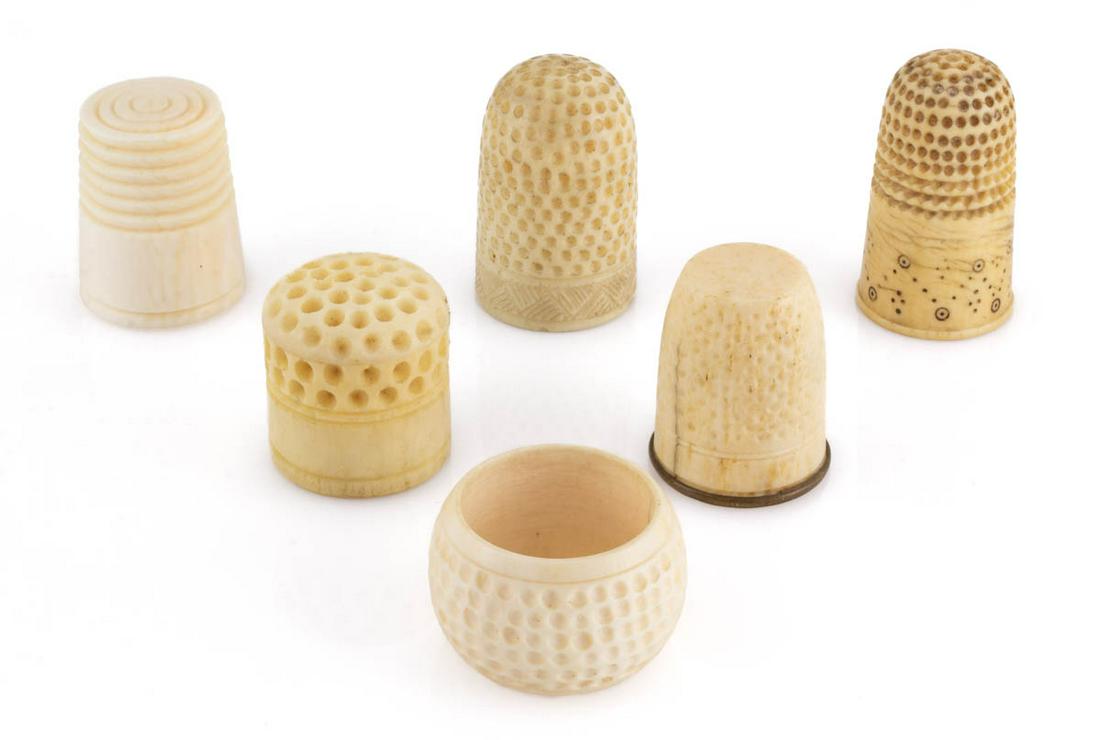 ASSORTED CONTINENTAL CARVED BONE SEWING THIMBLES, LOT OF SIX: ASSORTED CONTINENTAL CARVED BONE SEWING THIMBLES, LOT OF SIX, comprising an example with Dieppe-type work with tinted dot indentions of a zig-zag and diamond pattern, an example with a narrow Chevron-