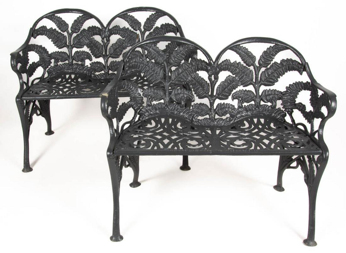 JAMES W. CARR, RICHMOND, VIRGINIA CAST-IRON PAIR OF GARDEN BENCHES / SETTEES: JAMES W. CARR, RICHMOND, VIRGINIA CAST-IRON PAIR OF GARDEN BENCHES / SETTEES, fern pattern, cast in four sections, each double-back form with rolled arms and scroll-pierced seat, raised on saber-like