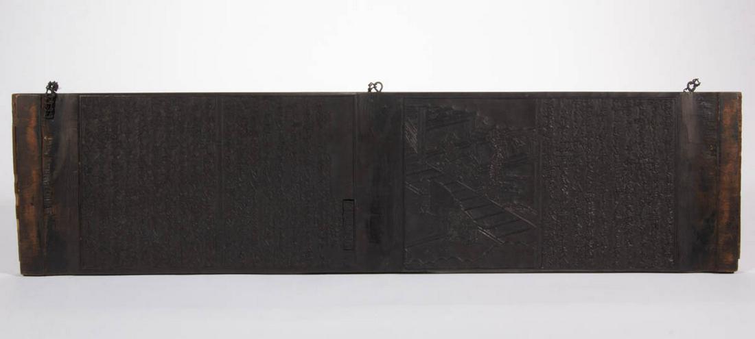 JAPANESE FINELY CARVED WOODBLOCK PRINTING PLATE: JAPANESE FINELY CARVED WOODBLOCK PRINTING PLATE, double-sided, with raised lettering, each side with a village or temple scene, with three later brackets for mounting. Retains an untouched surface. 19