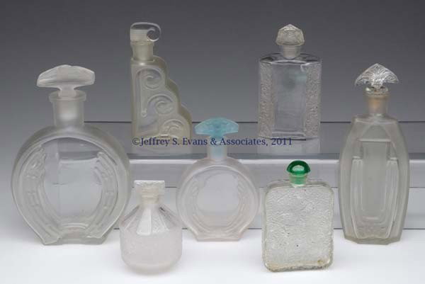 VINTAGE COMMERCIAL FRAGRANCE BOTTLES, LOT OF SEVEN: VINTAGE COMMERCIAL FRAGRANCE BOTTLES, LOT OF SEVEN, colorless and frosted finish, including one example embossed on base "J. VIARD", having an improper Coty stopper that is frozen; and a flask-type bo