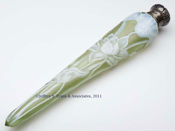 ENGLISH TWO-LAYER CAMEO TAPERED SCENT BOTTLE: ENGLISH TWO-LAYER CAMEO TAPERED SCENT BOTTLE, white to soft yellow green, floral design with butterfly on reverse, Gorham sterling screw-on cap engraved "M. B. to C. G. B.". Probably Thomas Webb & Son