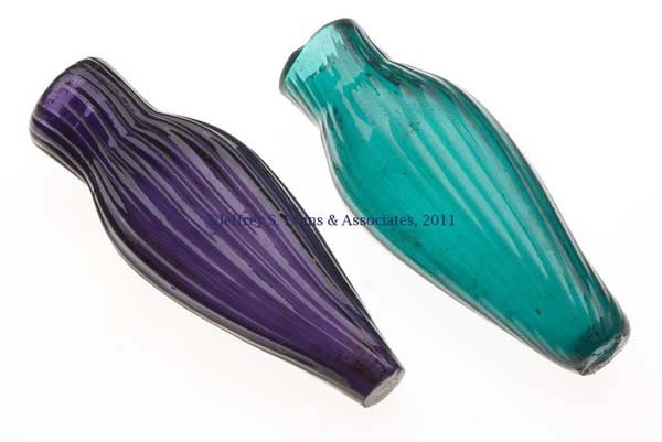 TWO PATTERN-MOLDED PUNGENTS: TWO PATTERN-MOLDED PUNGENTS, emerald green and deep amethyst, each of flattened tapered-ovoid form molded with vertical ribs, the green example with 26 and the amethyst example with 21, each with a pl
