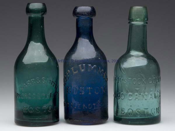 THREE ASSORTED BOSTON SODA BOTTLES: THREE ASSORTED BOSTON SODA BOTTLES, comprising a medium sapphire blue J. P. Plummer; a medium emerald green Tarr & Smith, Worcester, St.; and a strong blue green Comstock Gove & Co.; each with an appl