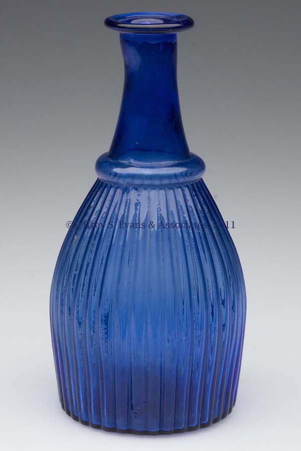 BLOWN-MOLDED GI-7 TYPE II CRUET OR TOILET BOTTLE: BLOWN-MOLDED GI-7 TYPE II CRUET OR TOILET BOTTLE, sapphire blue, folded rim, plain base with rough pontil mark. Probably Boston & Sandwich Glass Co. 1825-1835. 5 5/8" H. Provenance: Property of Art &