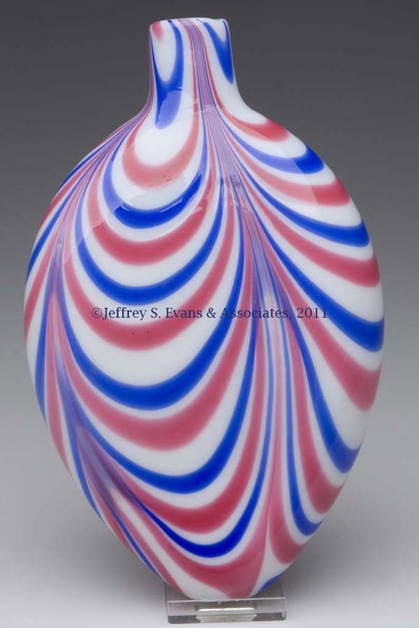 LUTZ-STYLE MARBRIE LOOP DECORATED FLASK: LUTZ-STYLE MARBRIE LOOP DECORATED FLASK, opal with four groups of red and blue loopings, flattened ovoid form with a plain mouth and ground pontil mark. Possibly by Nicholas Lutz working at the Boston