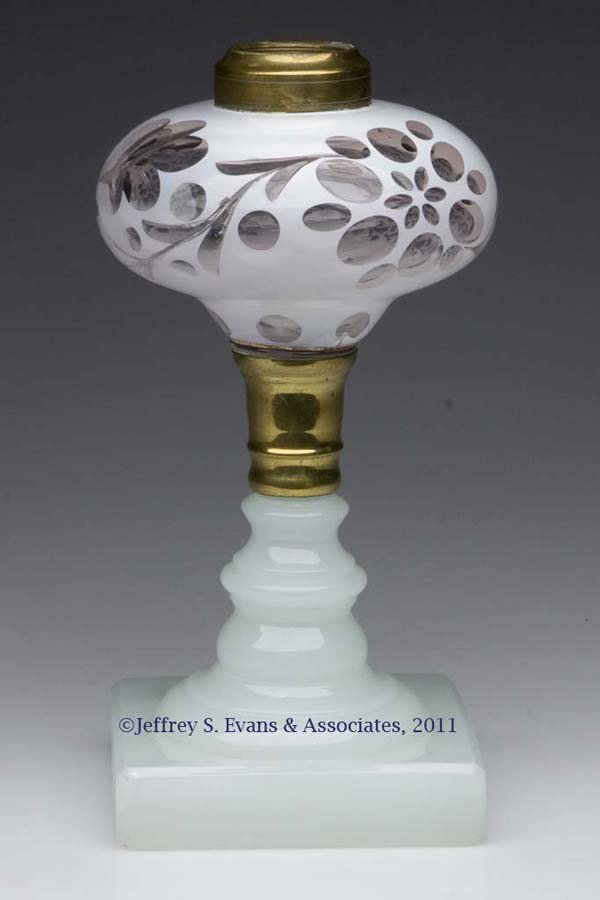 CUT OVERLAY KEROSENE STAND LAMP: CUT OVERLAY KEROSENE STAND LAMP, white to colorless squatty pyriform font with complex foliate and punty cuttings, raised on an alabaster/clambroth square base, brass connector and No. 2 fine line col
