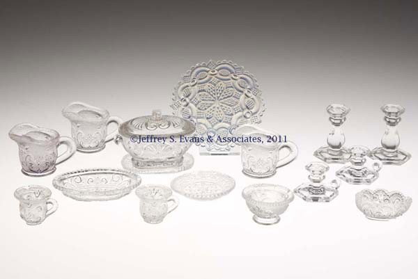 FOURTEEN ASSORTED PRESSED TOYS: FOURTEEN ASSORTED PRESSED TOYS, colorless, comprising two hexagonal candlesticks, a small size Lacy tureen with underplate, a Lacy jug retaining a William J. Elsholz Collection auction sticker, and 10