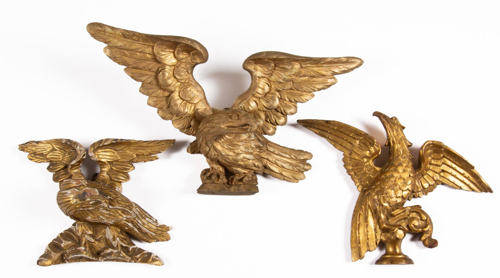 FOLK ART CARVED GILTWOOD EAGLE ARCHITECTURAL PEDIMENTS, LOT OF THREE (1 of 2)
