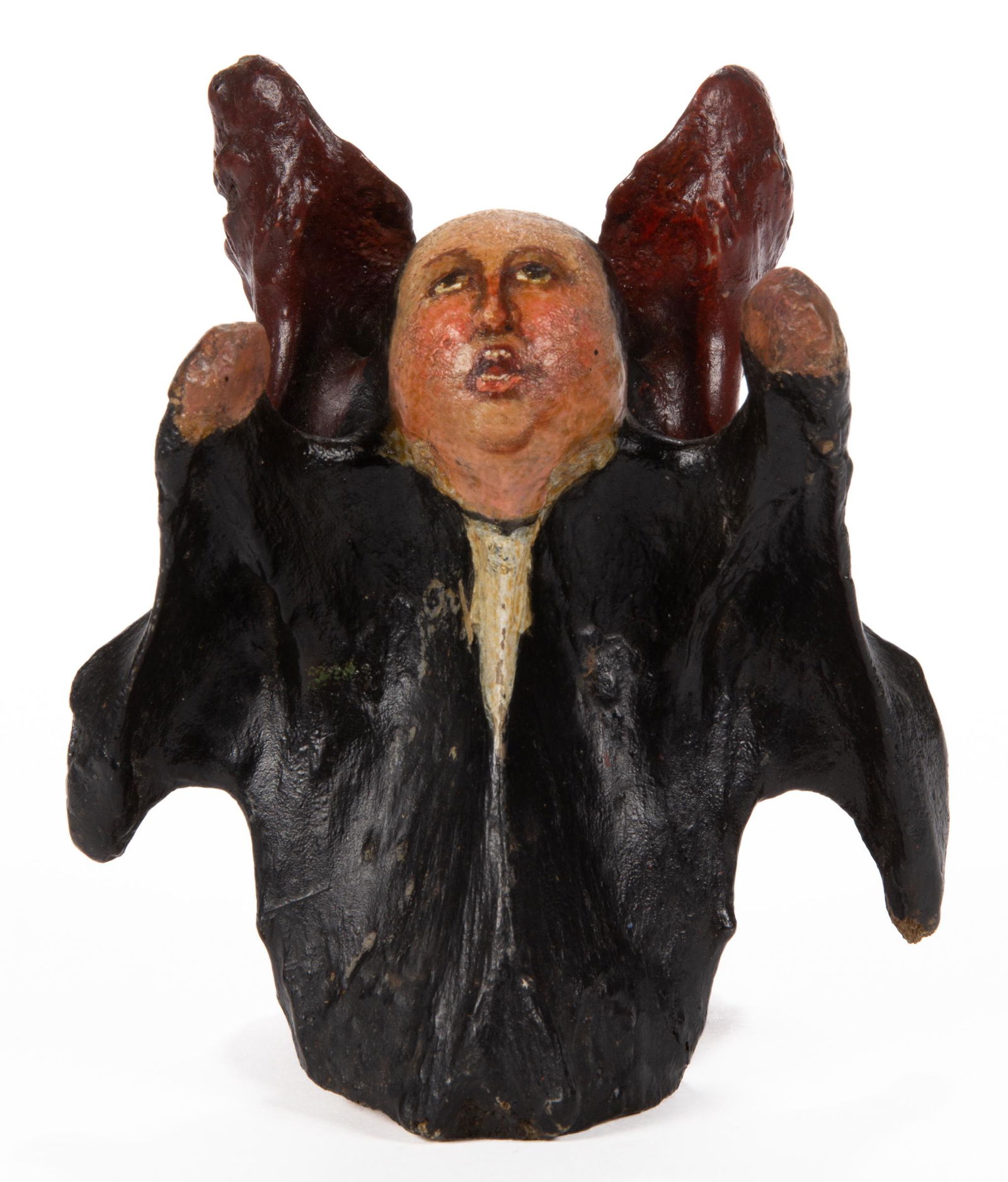 AMERICAN FOLK ART PAINTED BONE FIGURE: AMERICAN FOLK ART PAINTED BONE FIGURE, probably a cow vertebra, depicting a man with detailed face, open mouth, and up reaching arms, wearing a black coat, possibly a preaching robe, old inscribed lab