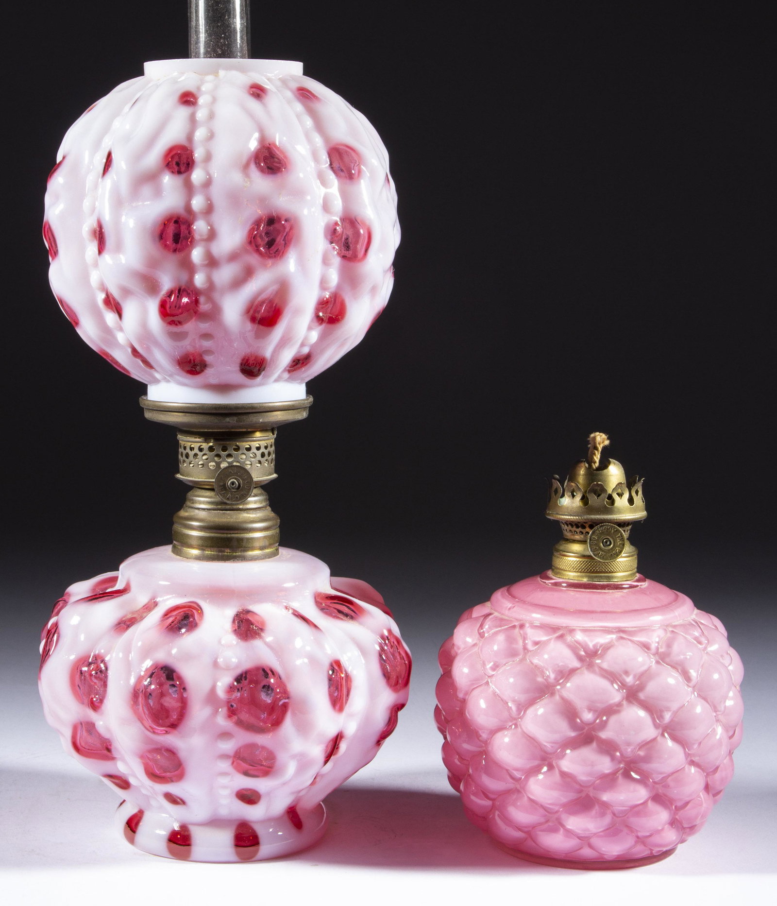 EYE DOT MINIATURE LAMP,: EYE DOT MINIATURE LAMP, cranberry opalescent, matching patterned ball-form shade, period No. 1 collar with interior fitted and adhered with a smaller collar. Fitted with a Plume & Atwood Nutmeg burner