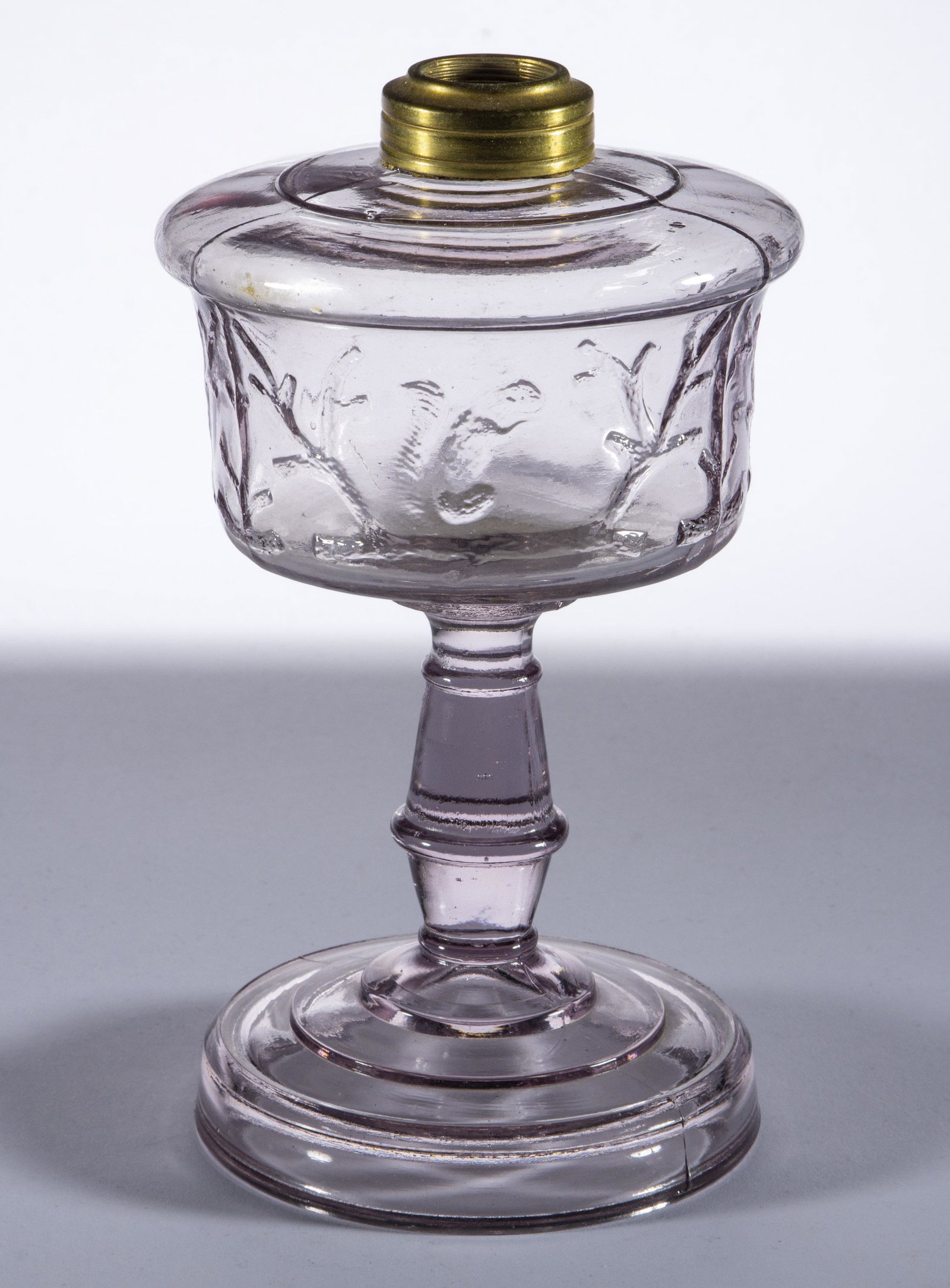 SQUIRREL KEROSENE STAND LAMP,: SQUIRREL KEROSENE STAND LAMP, colorless with gray tint, No. 1 Taplin-Brown collar. Fourth quarter 19th century. 7 1/4" H to top of collar, 3 7/8" D foot. Literature: Thuro - Oil Lamps I, p. 271, fig. 