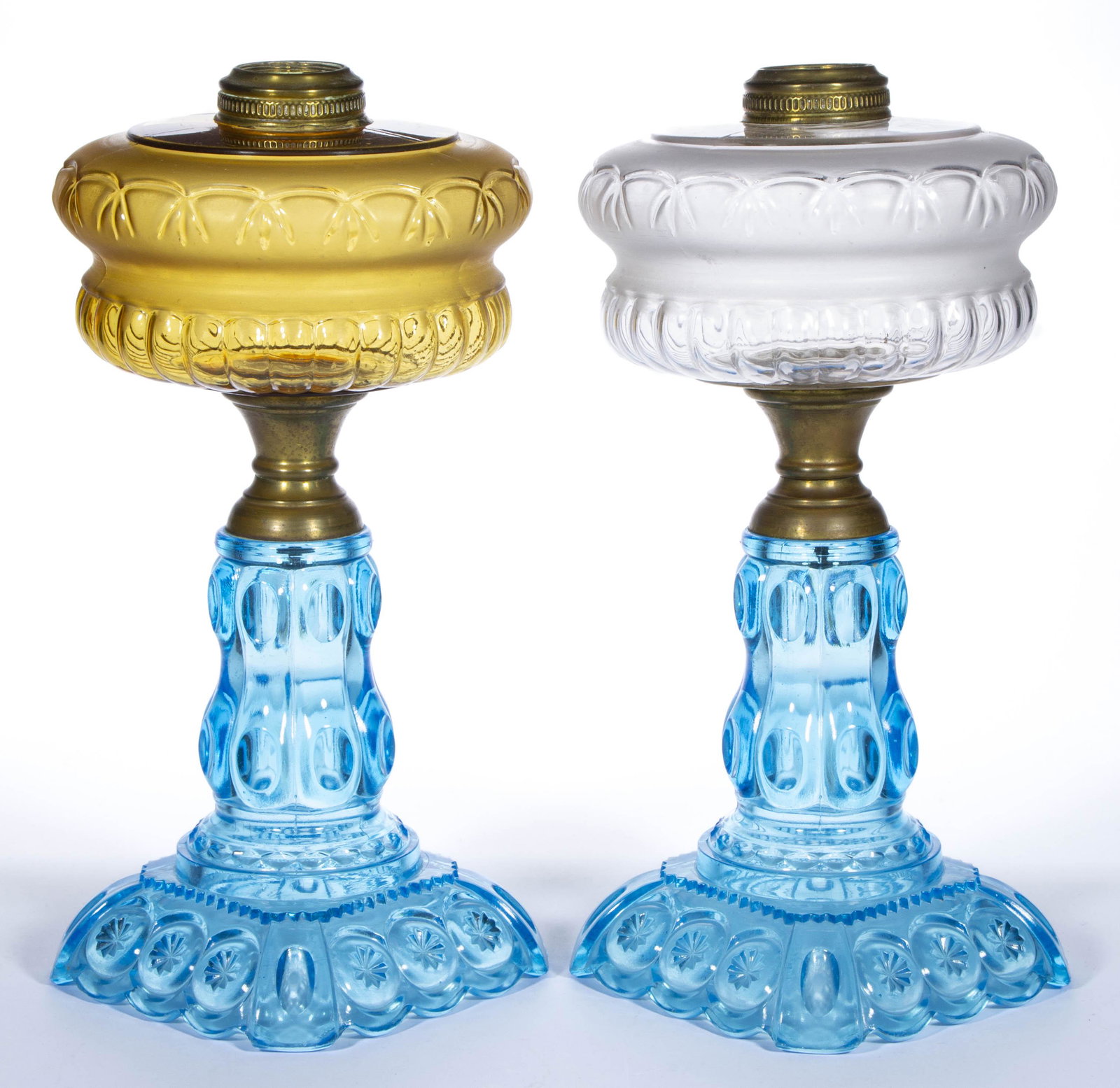 MOON AND STAR KEROSENE STAND LAMPS, LOT OF TWO,: MOON AND STAR KEROSENE STAND LAMPS, LOT OF TWO, comprising an example with a colorless and an amber font with satin finish, blue bases, brass connectors, No 2 Miller oval-band collars. Probably Adams 