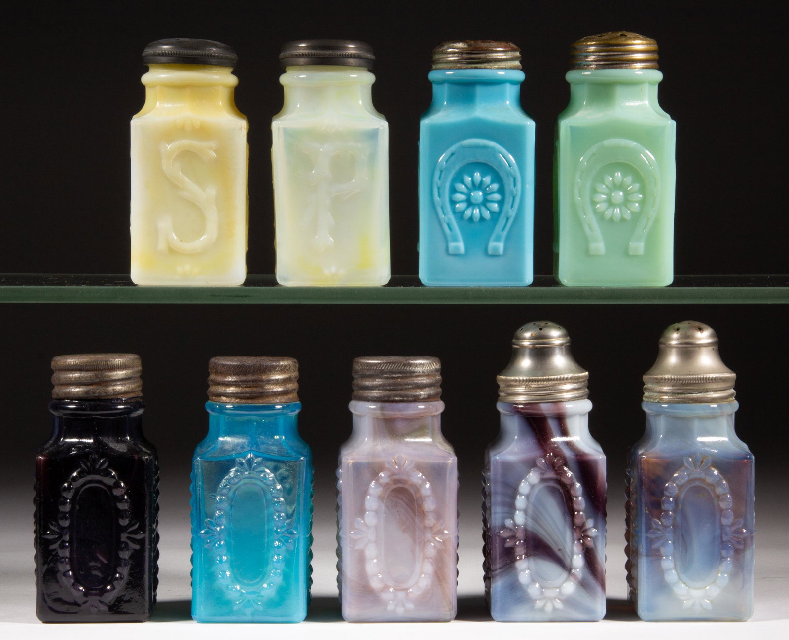 ASSORTED CHALLINOR SQUARE SALT AND PEPPER SHAKERS, LOT OF NINE,: ASSORTED CHALLINOR SQUARE SALT AND PEPPER SHAKERS, LOT OF NINE, various slag colors, comprising two Horseshoes, two lettered examples with one being "P" and the other "S", and five having oval reserve