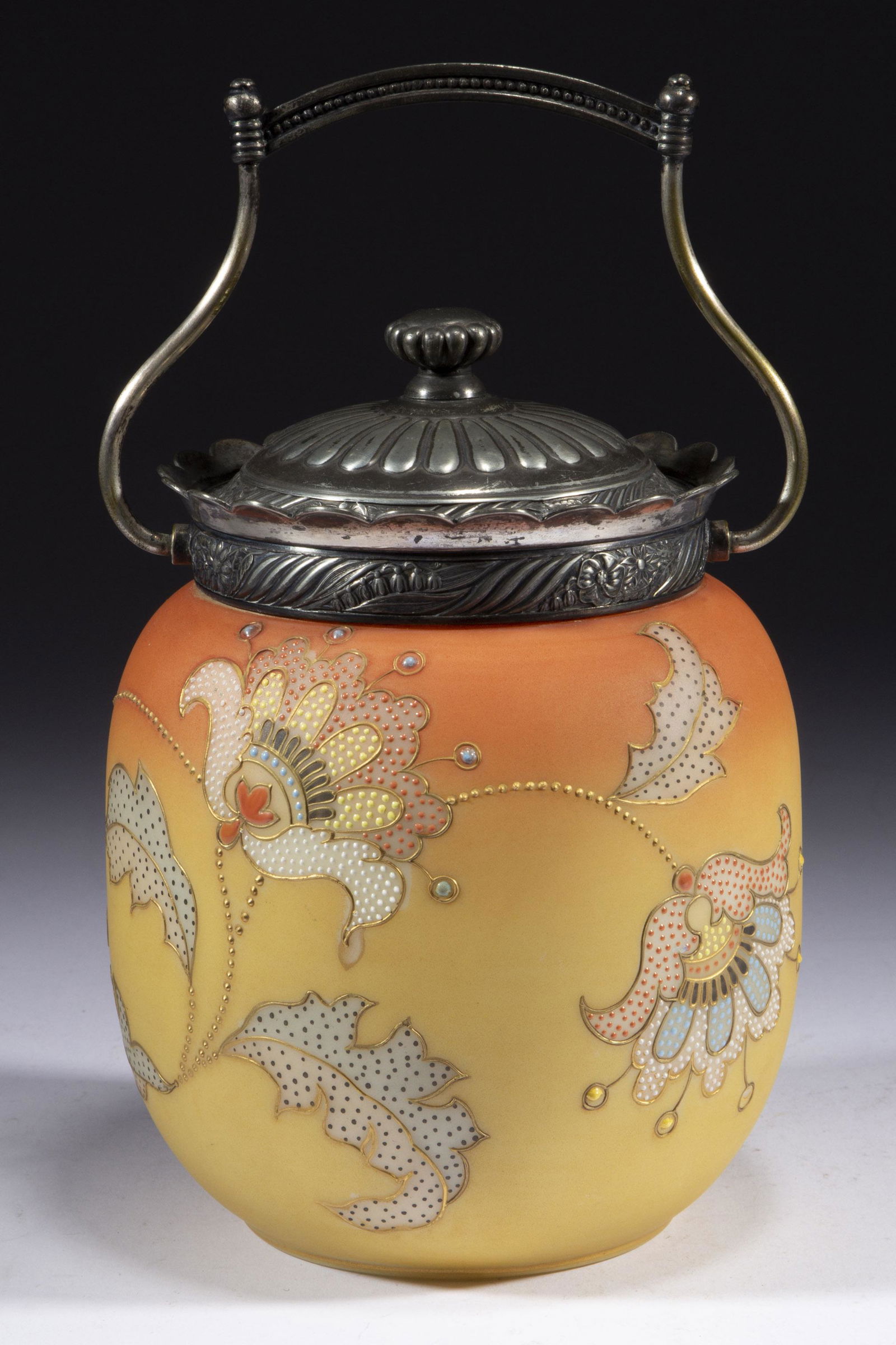 MT. WASHINGTON FIRED-ON BURMESE NO. 2599 CRACKER JAR,: MT. WASHINGTON FIRED-ON BURMESE NO. 2599 CRACKER JAR, opaque white with a fired-on Burmese ground and polychrome-enamel decoration, ovoid form with stylized floral decoration, original quadruple-plate