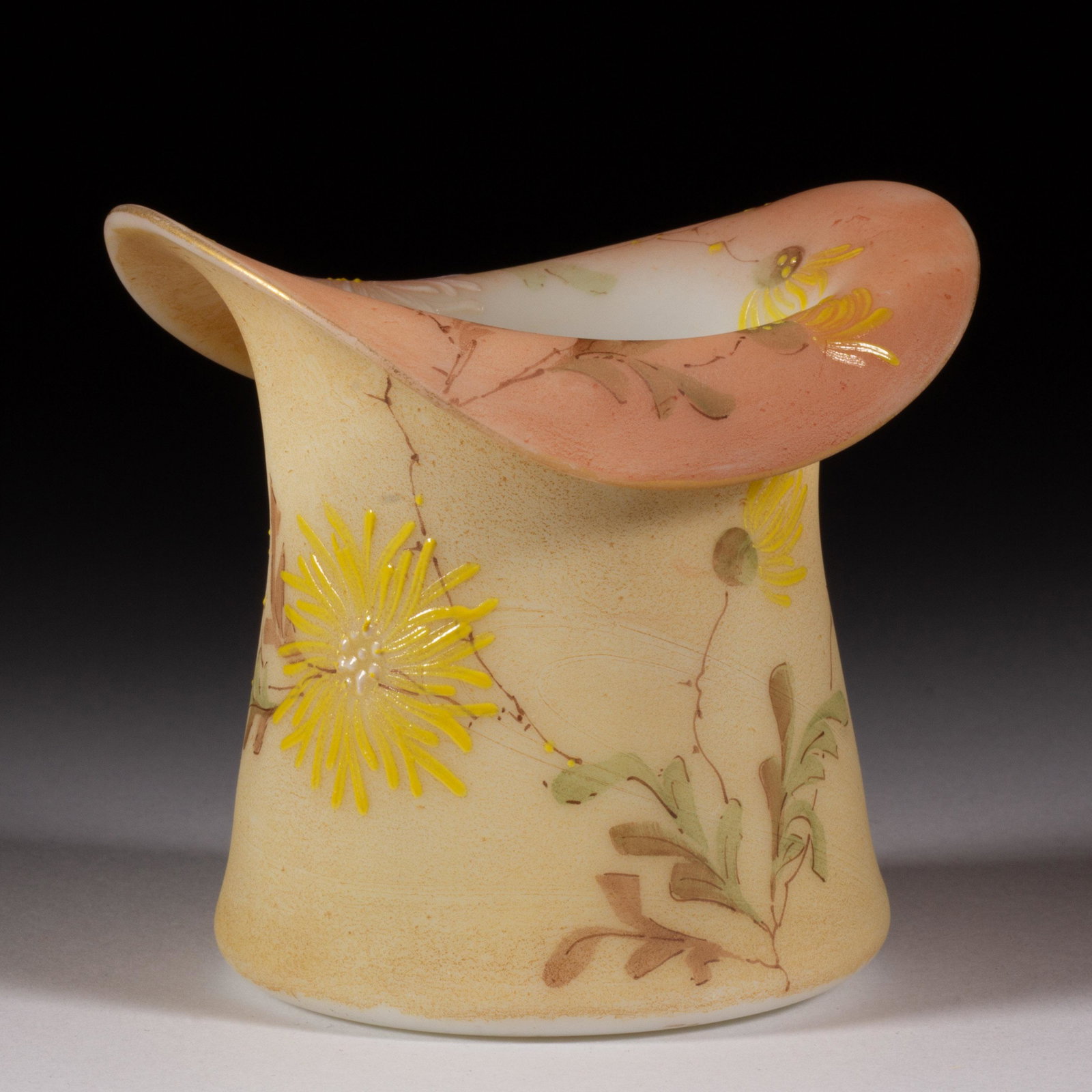 MT. WASHINGTON FIRED-ON DECORATED BURMESE FIGURAL HAT,: MT. WASHINGTON FIRED-ON DECORATED BURMESE FIGURAL HAT, opaque white with fired-on Burmese surface, polychrome-enamel decoration, floral decoration, polished pontil mark. Mt. Washington Glass Co. 1885-