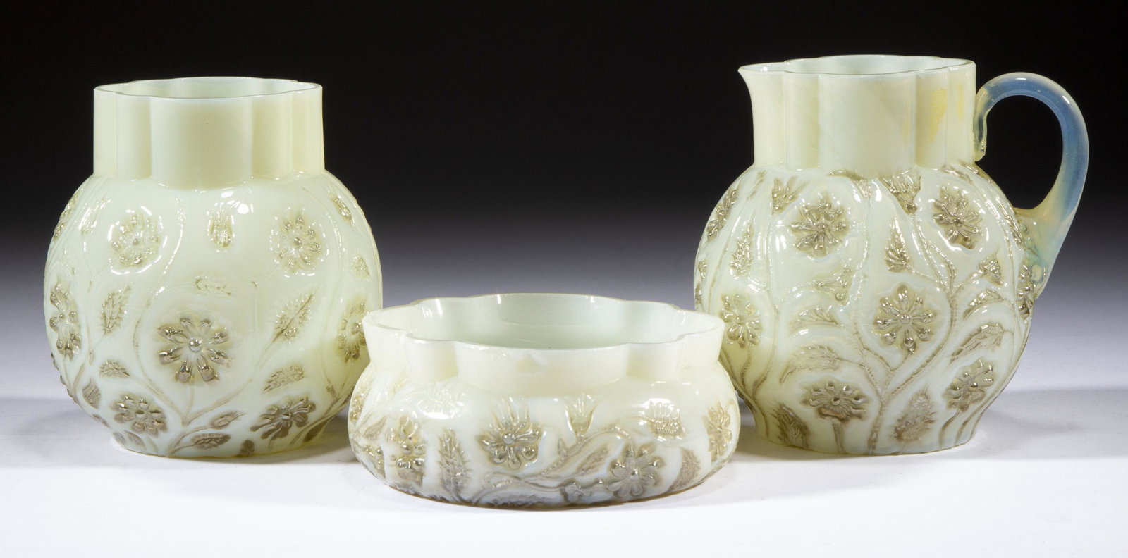 FINDLAY ONYX TABLE ARTICLES, LOT OF THREE,: FINDLAY ONYX TABLE ARTICLES, LOT OF THREE, ivory onyx, with platinum flowers, comprising a creamer, spooner, and berry bowl. Dalzell, Gilmore & Leighton. Circa 1889. 1 7/8" to 4 3/8" H. Bowl: 4" DOA r