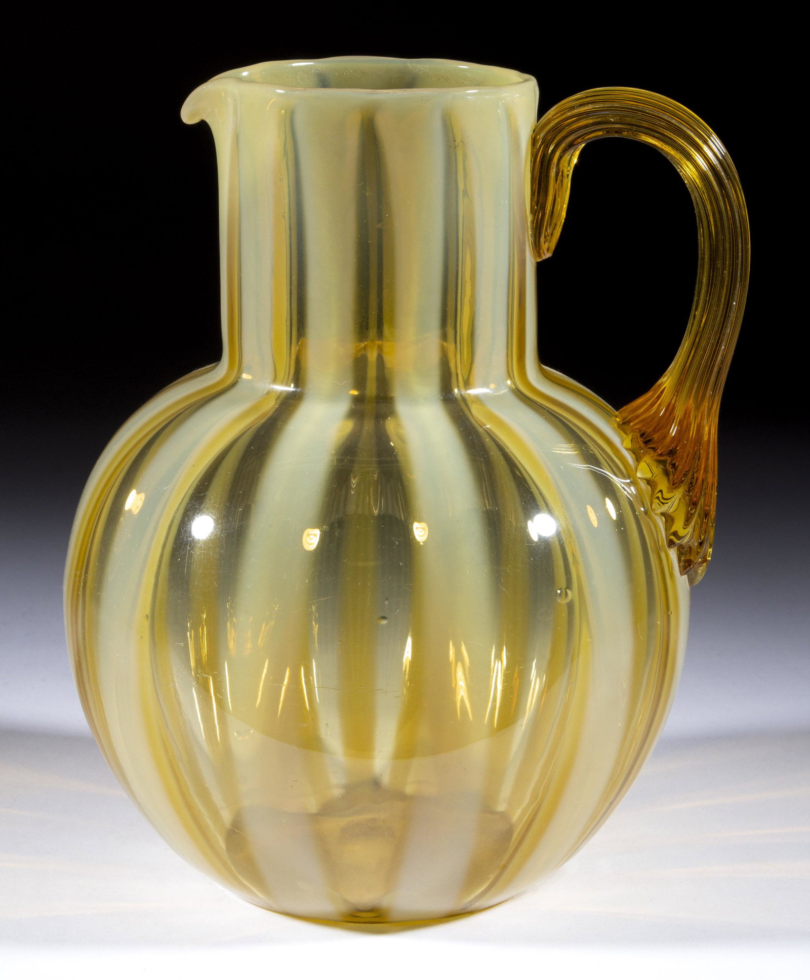 PHOENIX WIDE STRIPE OPALESCENT GLASS PITCHER,: PHOENIX WIDE STRIPE OPALESCENT GLASS PITCHER, amber opalescent, globular form with cylindrical neck, applied amber reeded handle, polished pontil mark. Phoenix Glass Co. Fourth quarter 19th century. 8
