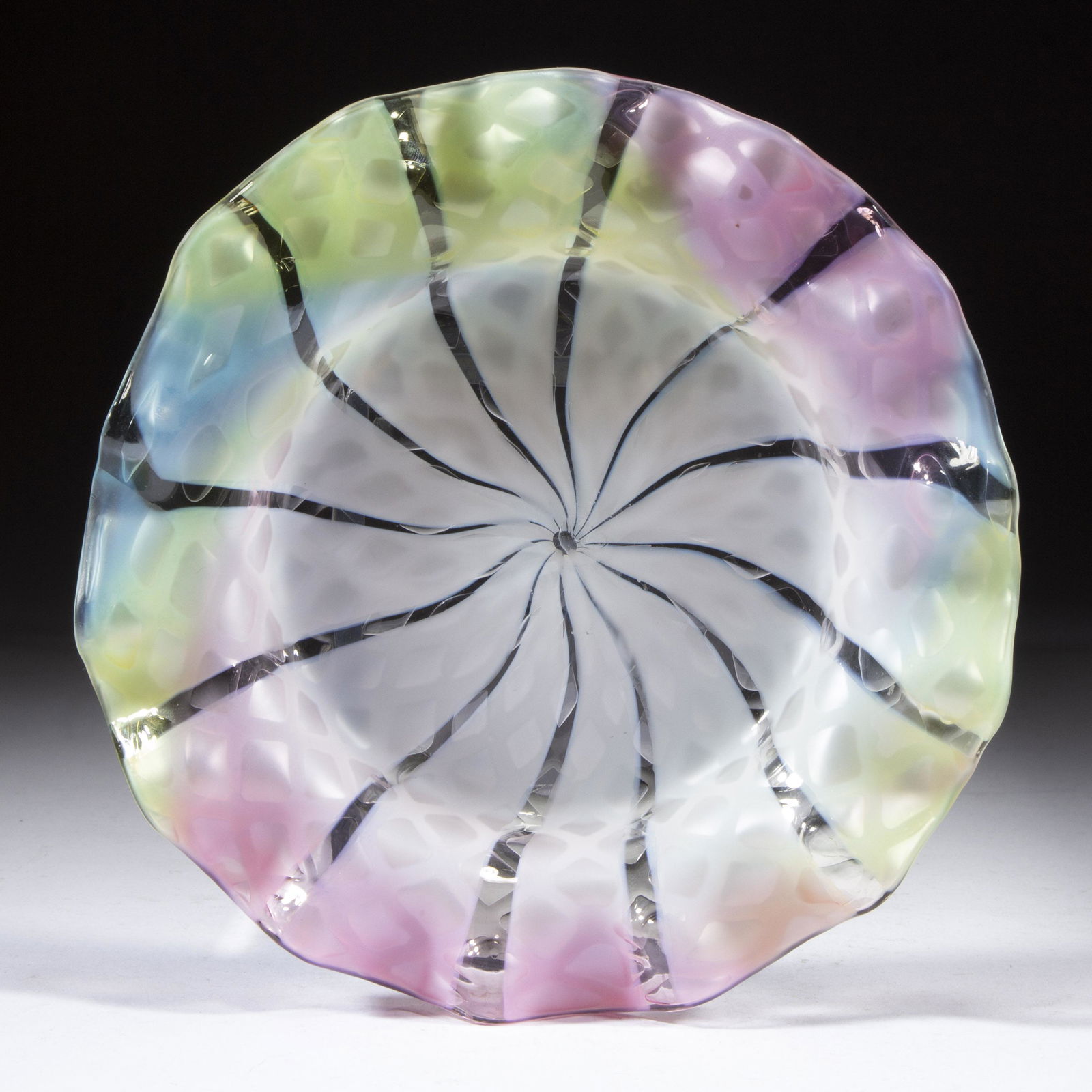 RAINBOW DIAMOND QUILT AIR-TRAP MOTHER-OF-PEARL SATIN GLASS PLATE,: RAINBOW DIAMOND QUILT AIR-TRAP MOTHER-OF-PEARL SATIN GLASS PLATE, colorless with opal stripes and three colors to the edge, etched "PATENT" to the underside, polished pontil mark. Probably Thomas Webb