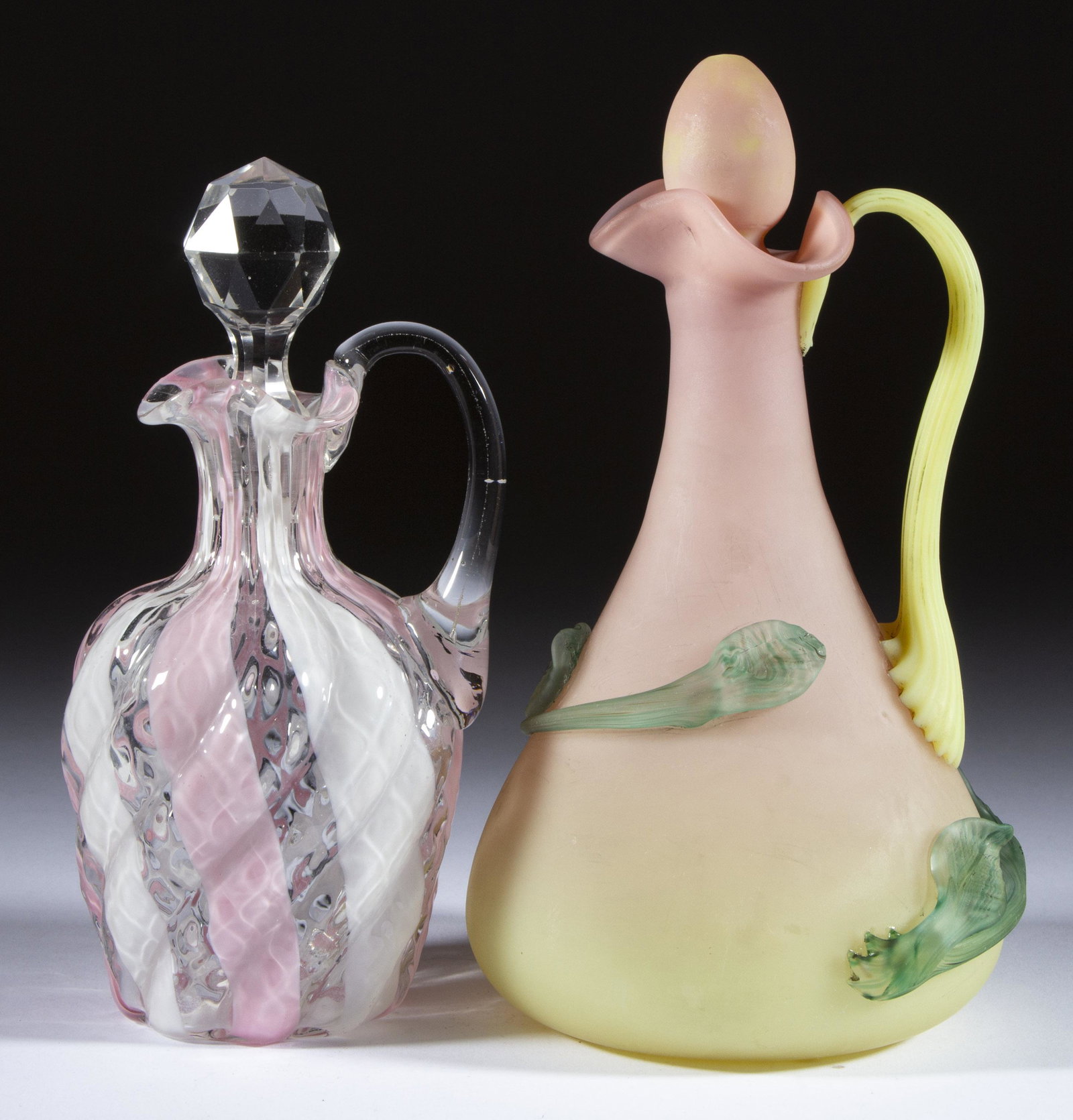 ASSORTED CONTINENTAL GLASS CRUETS, LOT OF TWO,: ASSORTED CONTINENTAL GLASS CRUETS, LOT OF TWO, comprising a plush Italian Burmese with applied mottled leaf and vine decoration, and a colorless Wide Stripe with opal and pink vertical stripes, each h