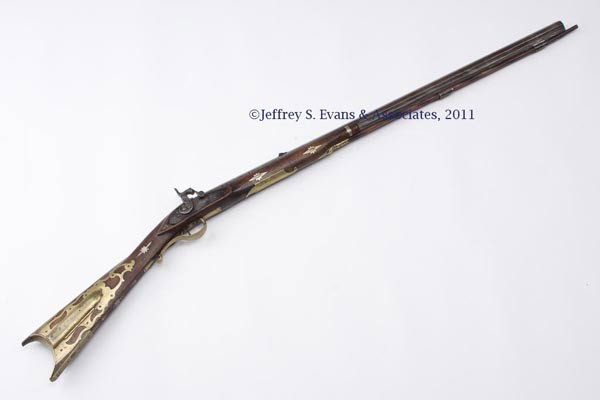 UNSIGNED KENTUCKY-STYLE PERCUSSION LONG RIFLE: UNSIGNED KENTUCKY-STYLE PERCUSSION LONG RIFLE, walnut half-stock with unusual brass fold-down patchbox and 16 German silver inlays including stars and a heart-pierced escutcheon, octagon barrel, worn 