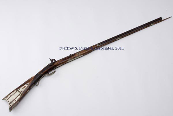 UNSIGNED KENTUCKY-STYLE PERCUSSION LONG RIFLE: UNSIGNED KENTUCKY-STYLE PERCUSSION LONG RIFLE, tiger maple half-stock with fine engraved German silver patch box, trigger guard, fore stock wear plate, and inlays including a fox and a fish, checkered
