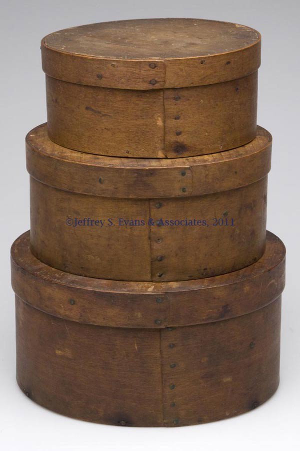 STACK OF THREE AMERICAN BENTWOOD PANTRY BOXES: STACK OF THREE AMERICAN BENTWOOD PANTRY BOXES, each of graduated circular form, lapped construction with steel and/or copper tacks and wooden pins. Original natural surfaces. Second half 19th century.