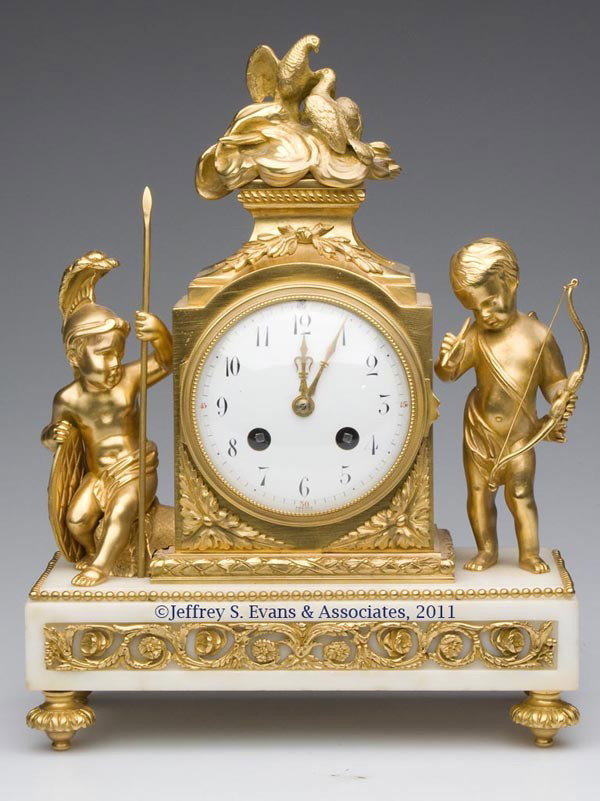 FRENCH DORE BRONZE AND WHITE MARBLE FIGURAL CLOCK: FRENCH DORE BRONZE AND WHITE MARBLE FIGURAL CLOCK, the figures depicting "War and Peace", porcelain dial inscribed "FRANCE", movement marked for S. Martie & Cie, Paris. Late 19th/early 20th century. 1