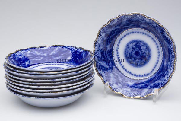 ENGLISH STAFFORDSHIRE TRANSFERWARE FLOW BLUE SET: ENGLISH STAFFORDSHIRE TRANSFERWARE FLOW BLUE SET OF TEN BOWLS, light gilt decoration, base bears the name "MIKADO" and "ROYAL STAFFORDSHIRE POTTERY" Arthur J. Wilkinson, Burslem, England. Early 20th c