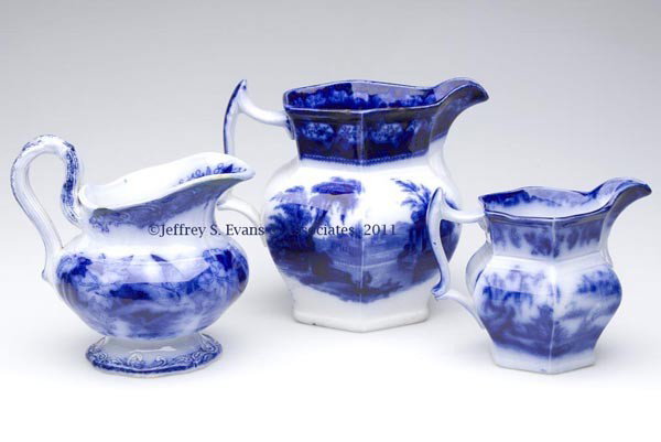 ENGLISH STAFFORDSHIRE TRANSFERWARE FLOW BLUE PITCH: ENGLISH STAFFORDSHIRE TRANSFERWARE FLOW BLUE PITCHERS, LOT OF THREE, comprising two unmarked hexagonal examples, Excelsior by Thomas Fell, and possibly Beauties of China; and a round example with entw