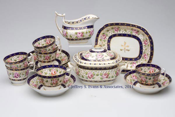 ENGLISH PORCELAIN PARTIAL TEA SERVICE: ENGLISH PORCELAIN PARTIAL TEA SERVICE, elaborate floral polychrome and gilt decoration, 15 pieces, comprising a creamer, sugar, small tray, five demitasse cup and saucer sets, and one tea cup and sauc