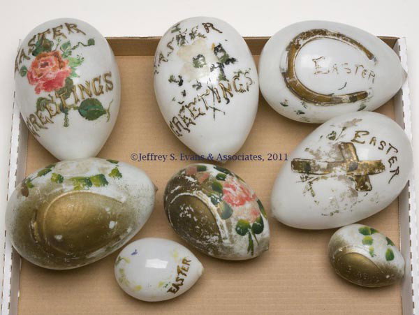 EMBOSSED AND DECORATED EGGS, LOT OF EIGHT: EMBOSSED AND DECORATED EGGS, LOT OF EIGHT, opaque white/milk glass with polychrome decoration, comprising a four-piece graduated set with embossed horseshoe and "EASTER", two embossed "EASTER GREETING