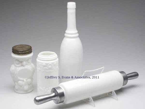 VARIOUS DOMESTIC ARTICLES, LOT OF FOUR: VARIOUS DOMESTIC ARTICLES, LOT OF FOUR, opaque white/milk glass, comprising an Owl and a Flaccus jar, latter lacking lid; an unpatterned bottle; and a rolling pin with metal handles, one of which unsc