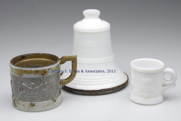 HISTORICAL THEME CHILDREN'S ARTICLES, LOT OF THREE: HISTORICAL THEME CHILDREN'S ARTICLES, LOT OF THREE, opaque white/milk glass, comprising a Liberty Bell bank, tin lid embossed "ROBINSON & LOEBLE / 723 WHARTON ST. / PHILA, PA.", hanger embossed "PATEN