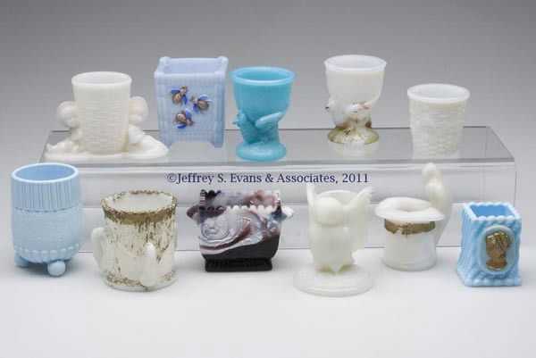 OPAQUE / MILK GLASS TOOTHPICK HOLDERS AND OTHER AR: OPAQUE / MILK GLASS TOOTHPICK HOLDERS AND OTHER ARTICLES, LOT OF 11, various colors, five with some original decoration, including Bees in Basket; Three Swans; one Sowerby example; and two Hen egg cup