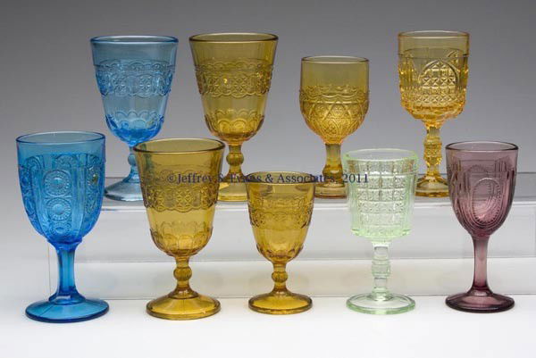 VARIOUS EAPG STEMS, LOT OF NINE: VARIOUS EAPG STEMS, LOT OF NINE, various colors, including three Cottage clarets, and a wine; and a apple green Two Panel wine. Fourth quarter 19th century. 3 5/8" to 4 1/2" H. Provenance: From the c