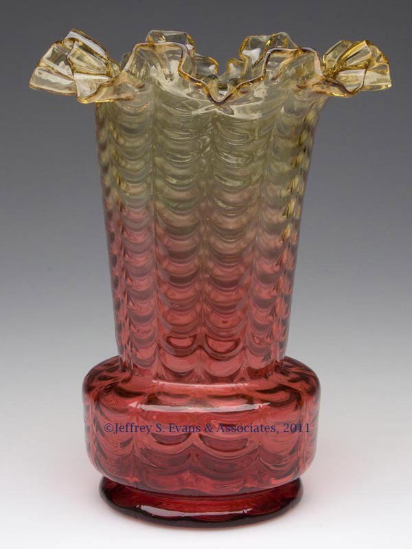 AMBERINA - REVERSE, DRAPE-OPTIC VASE: AMBERINA - REVERSE, DRAPE-OPTIC VASE, crimped and ruffled top, polished pontil mark. Late 19th/early 20th century. 7 3/4" HOA, 3 1/2" D base. Provenance: From a Massachusetts private collection.