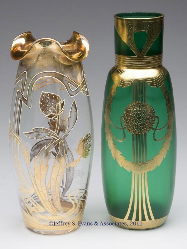 ART NOUVEAU GILT-DECORATED VASES, LOT OF TWO: ART NOUVEAU GILT-DECORATED VASES, LOT OF TWO, emerald green satin finish and colorless, latter example with a polished pontil mark. Late 19th/early 20th century. 8 3/4" H, 3" DOA, and 8" HOA, 3 1/2" D