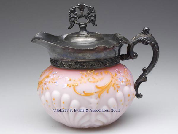 VICTORIAN DECORATED SYRUP / CREAM PITCHER: VICTORIAN DECORATED SYRUP / CREAM PITCHER, opaque white with dark to light pink ground and polychrome decoration, satin finish, lower body with large shell pattern, polished pontil mark, period silver