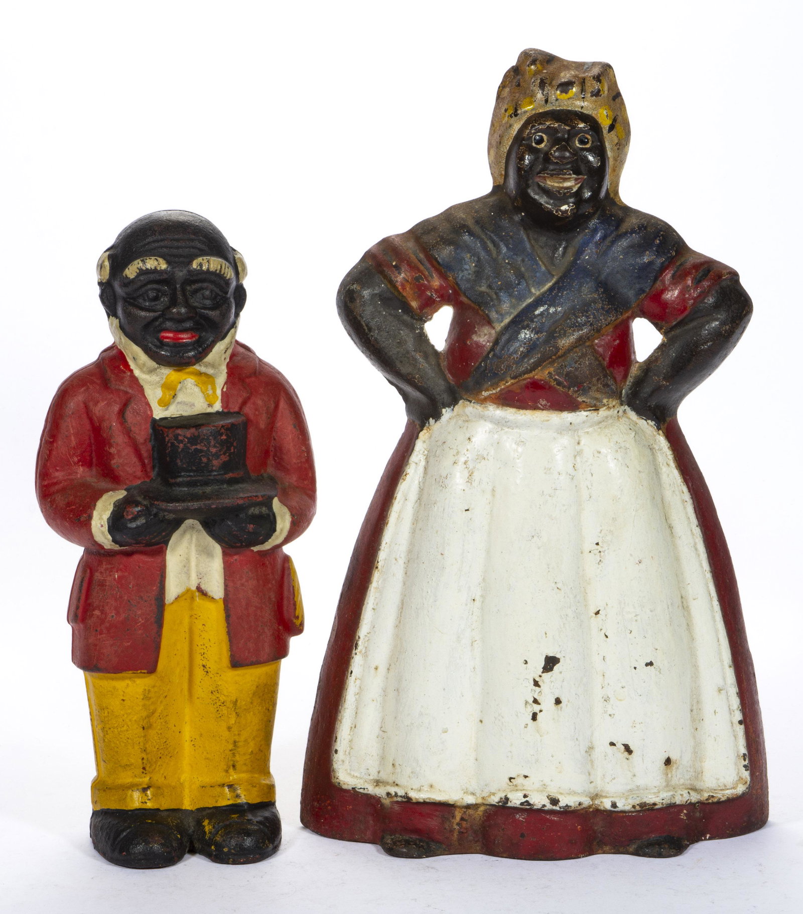 VINTAGE BLACK AMERICANA FIGURAL CAST-IRON ARTICLES, LOT OF TWO,: comprising a large Mammy with hands on hips hollow-body doorstop and a butler figure still bank of unknown age and origin. 20th century. Doorstop 13 1/4" HOA.