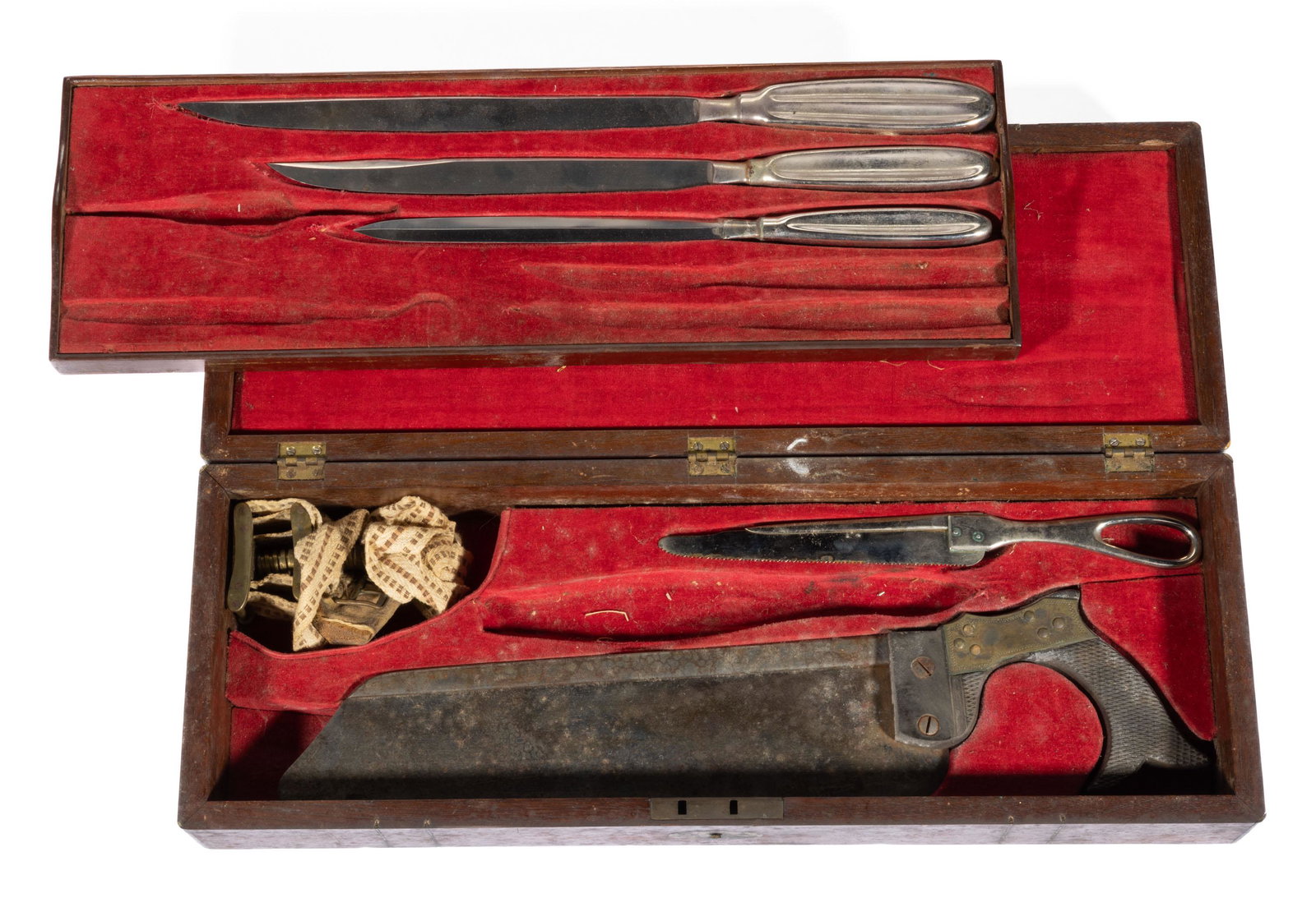 CIVIL WAR SURGICAL AND AMPUTATION CASED FIELD KIT,: brass-bound rosewood hinged-lid case with lift-out tray and velvet-lined fitted interior, containing a partial set of instruments including capital saw, narrow bone saw (probably not original), catlin