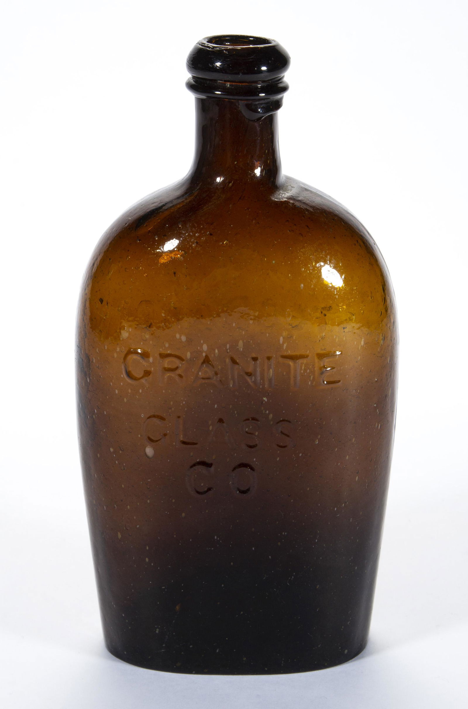 GXV-7 STODDARD / GRANITE HISTORICAL FLASKS,: deep amber, pint, embossed "STODDARD / N.H.", and "GRANITE / GLASS / CO.", applied lip, plain base. Granite Glass Works, Stoddard, NH. 1840-1860. 7 1/8" H.Provenance: From the Eddie Tatum estate colle