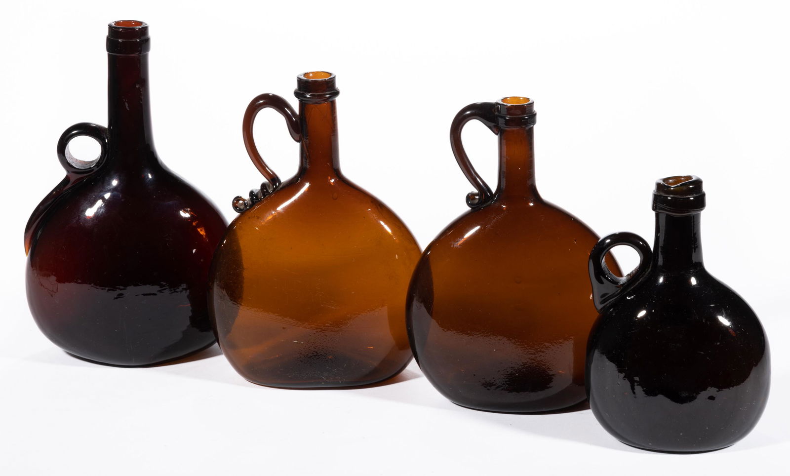 BLOWN CHESTNUT-FORM HANDLED WHISKEY BOTTLES, LOT OF FOUR, (1 of 1)