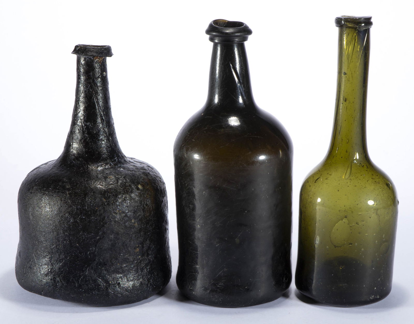 ASSORTED FREE-BLOWN BLACK-GLASS UTILITY BOTTLES, LOT OF THREE, (1 of 4)