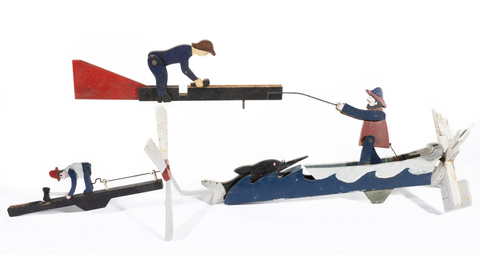 AMERICAN FOLK ART PAINTED WHIRLIGIGS, LOT OF THREE,: each with cut-out figures, including one having fisherman with line and attached to a painted wooden sport fish, possibly a marlin. Each retains original polychrome painted surface. 20th century. Marl