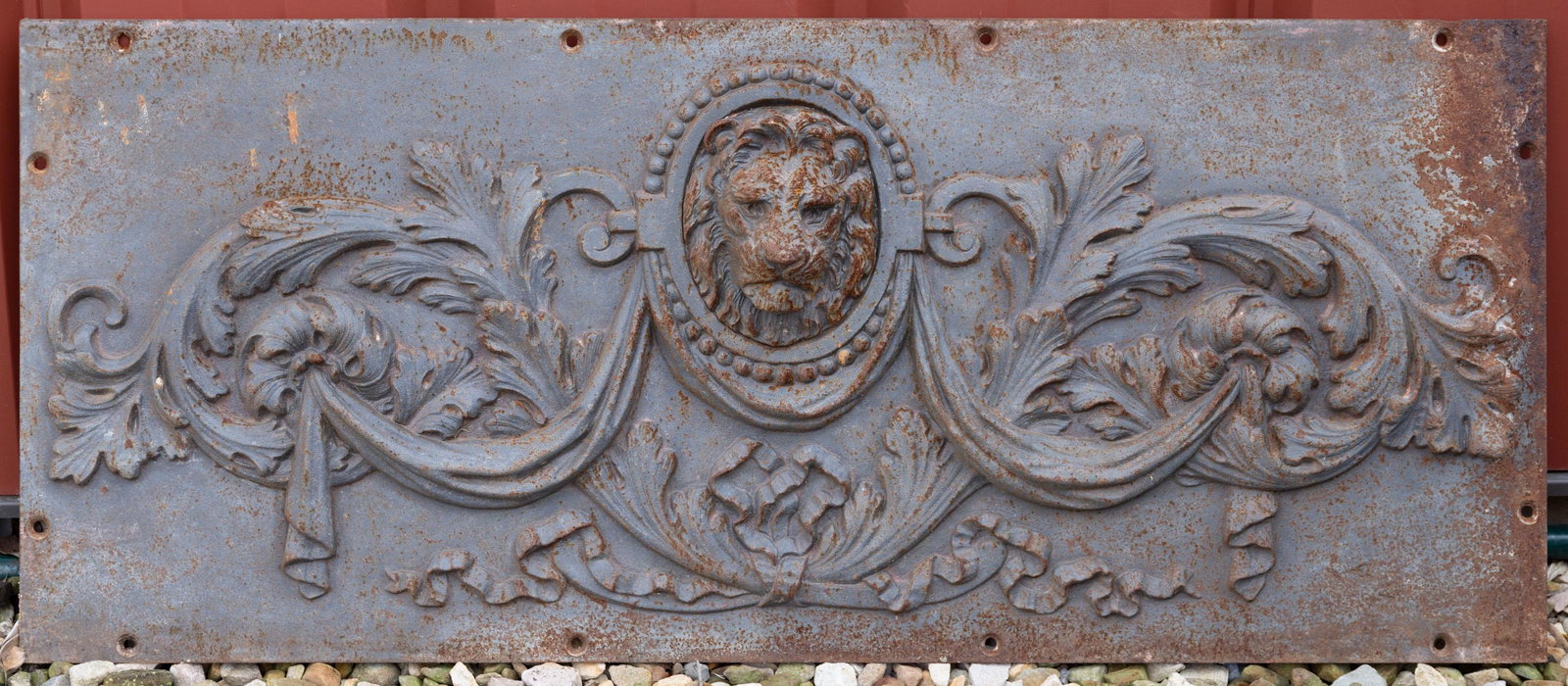 CAST-IRON LION HEAD WALL MOUNT / PLAQUE,: no markings located. 20th century. 18 3/4" x 45". Shipping Note: IN-HOUSE SHIPPING IS NOT AVAILABLE FOR THIS LOT. Please contact our local UPS store store6595@theupsstore.com for information on shippi