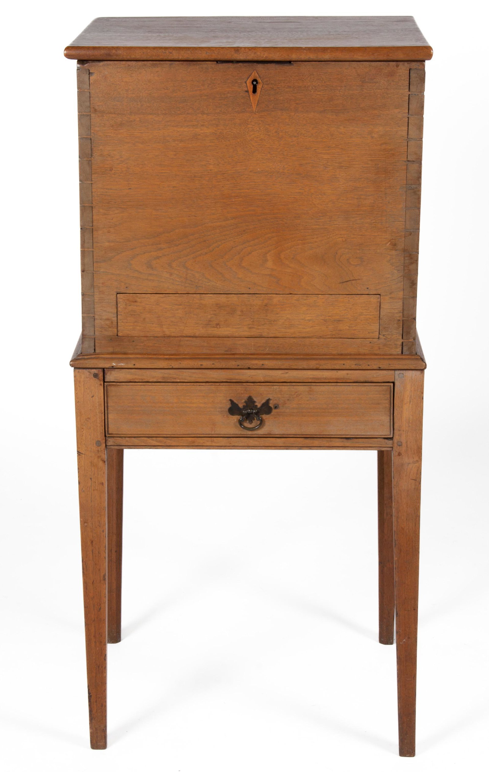 VIRGINIA WALNUT CELLARETTE,: two-piece construction, upper case with rectangular strap-hinged lid, above dovetailed case with dividers, over full-length drawer, above mixing slide, lower case with drawer having later brass pull, 