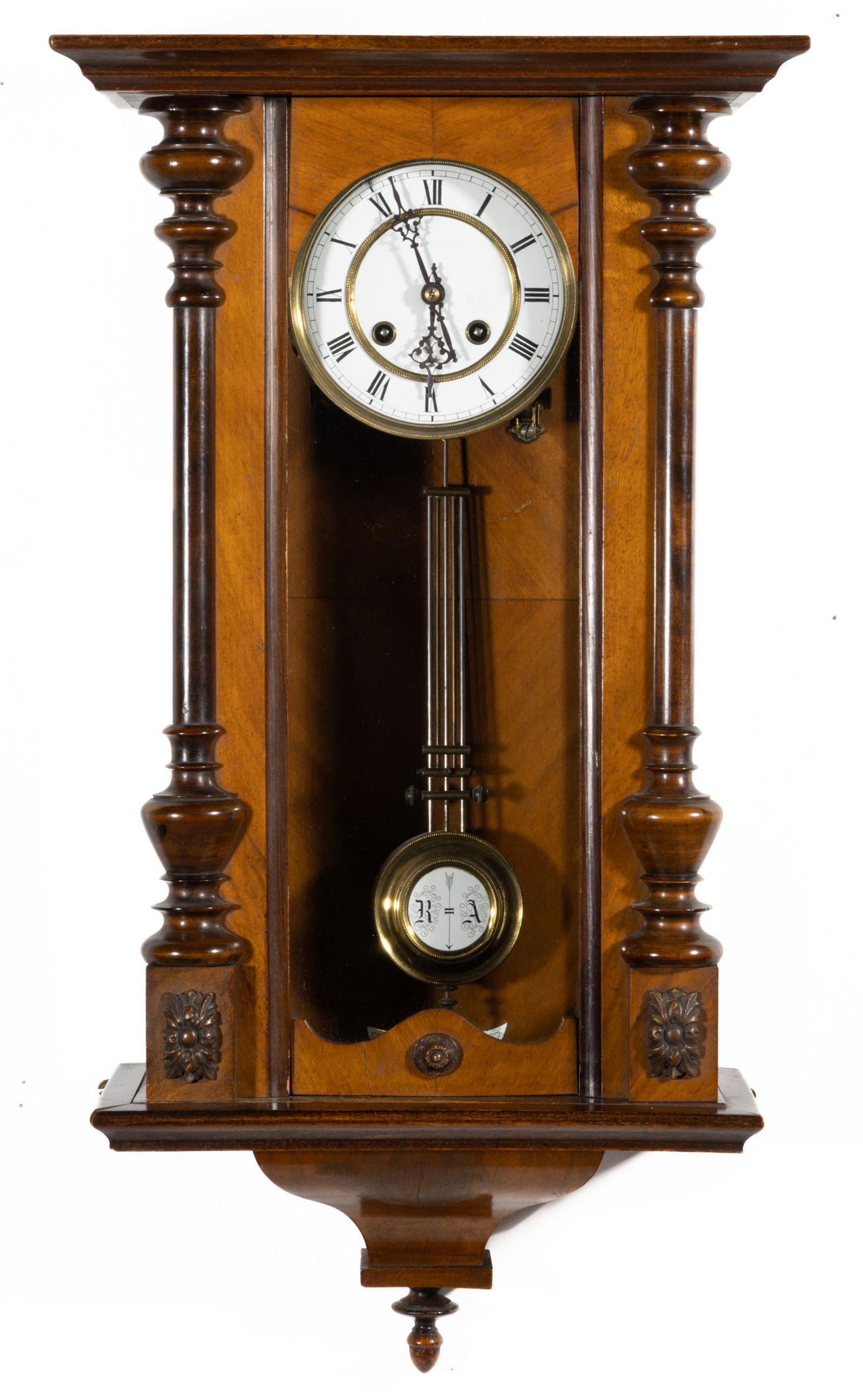 GERMAN REGULATOR WALL CLOCK,: porcelain dial, pendulum inset, and leveling gauge, walnut case with applied half-columns. Key and pendulum present. Fourth quarter 19th/early 20th century. 27 1/2" HOA, 14 1/2" WOA. Provenance: Prope