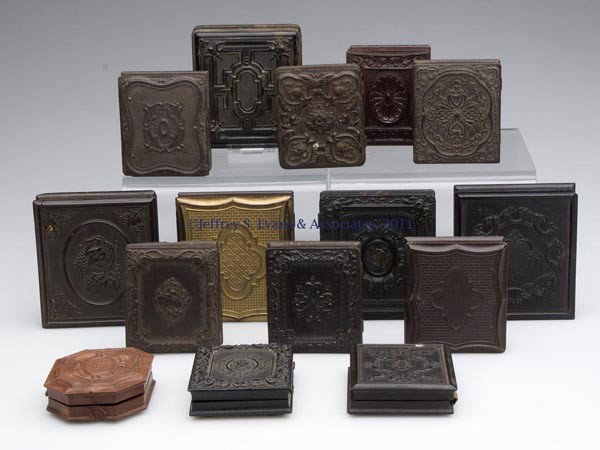 FIFTEEN ASSORTED UNION CASES: FIFTEEN ASSORTED UNION CASES, sixth-plate and ninth-plate sizes, most with an ambrotype or daguerreotype image. Mid 19th century. Provenance: Pennsylvania private collection.