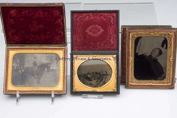 THREE ASSORTED CHILDREN CASED IMAGES: THREE ASSORTED CHILDREN CASED IMAGES, comprising a quarter-plate ambrotype of a boy on a horse, a sixth-plate ambrotype postmortem of a boy, and a quarter-plate tintype postmortem of a baby. Each in a