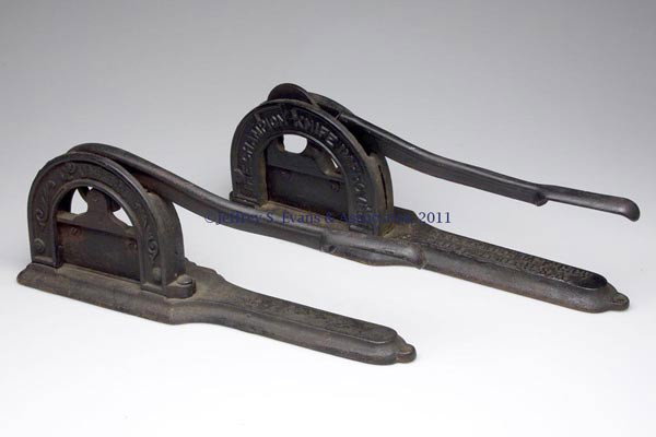 TWO CAST-IRON TOBACCO CUTTERS: TWO CAST-IRON TOBACCO CUTTERS, marked "QUEEN" by the Wrightsville Hardware Co., Wrightsville, PA, and ""THE CHAMPION KNIFE IMPROVED" by the Enterprise Mfg. Co., Philadelphia, PA. Fourth quarter 19th c
